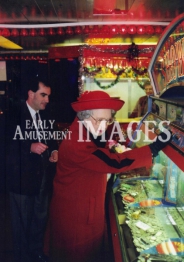media-image-060-the-queen-playing-a-pusher-slot-machine-wembley-london-1992-rp